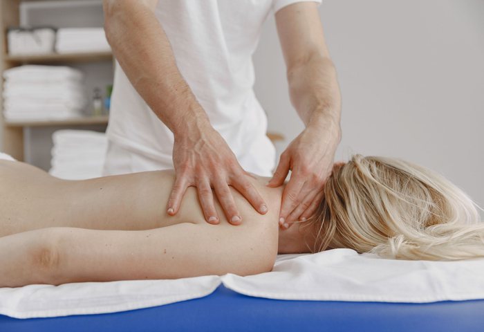 Registered massage therapist providing deep tissue treatment